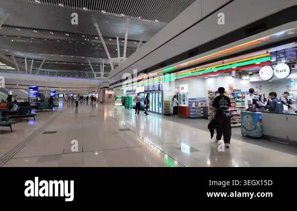 Hong Kong Airport arrivals hall with passengers and signage April 24 ...