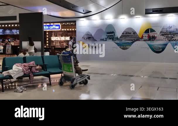 Hong Kong Airport arrivals hall with passengers and signage April 24 ...