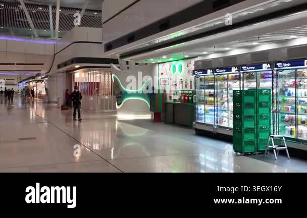Hong Kong Airport arrivals hall with passengers and signage April 24 ...