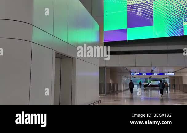 Hong Kong Airport arrivals hall with passengers and signage April 24 ...