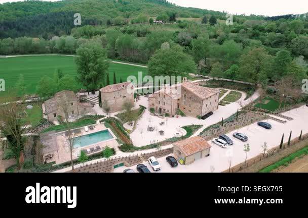 Aerial view rustic stone villa courtyard pool overlooking turquoise ...