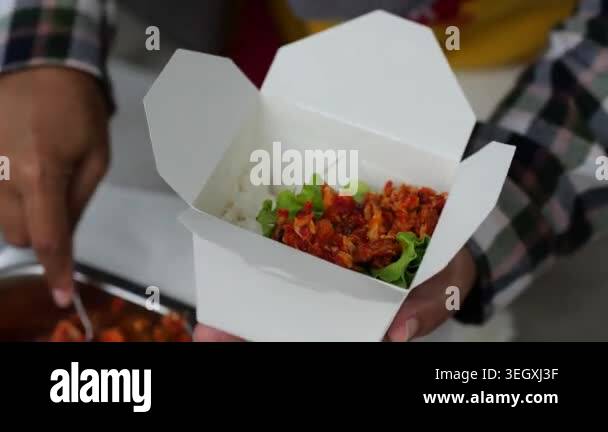 Preparing rice box. Making rice balls populer street food in Indonesia ...