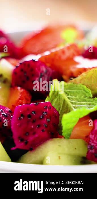 extreme close up macro of fresh fruit salad with dragon fruit ...