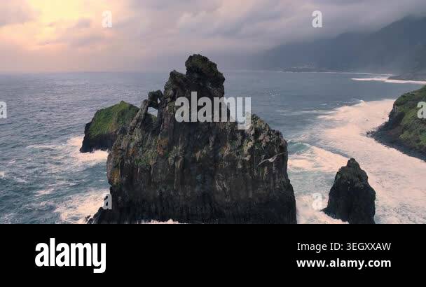 Dramatic view of rock formations and crashing ocean waves landscape ...