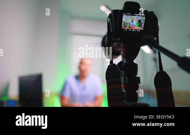 Rear Camera View Of Doctor Recording Medical Video. Rear camera view ...