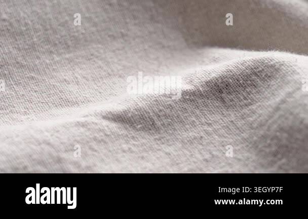 Crumpled beige linen fabric texture with organic weave pattern and ...