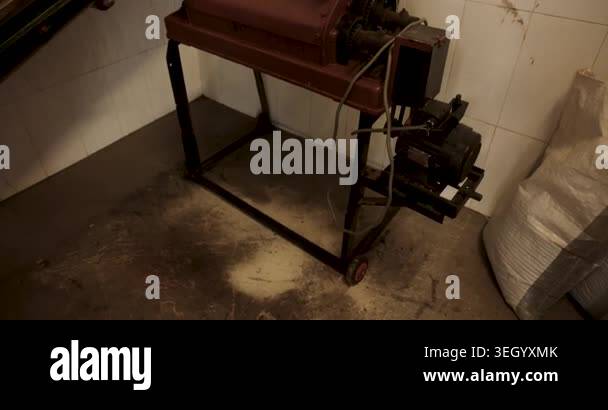 A green tea processing factory in a warehouse with machinery for drying ...