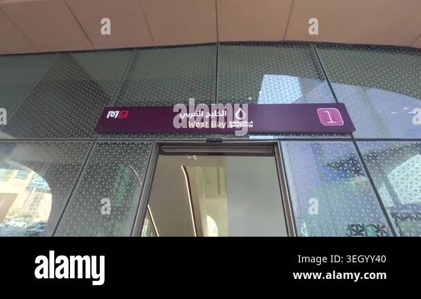 Signage on glass storefront indicating 'West Bay' in a modern ...