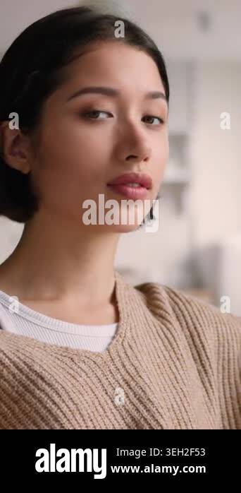 Portrait happy smiling Hispanic Caucasian woman home kitchen looking at ...