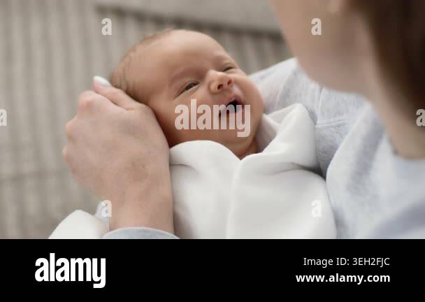 Mom Rocking A Newborn Baby Girl In Arms, Close-Up Stock Video Footage ...