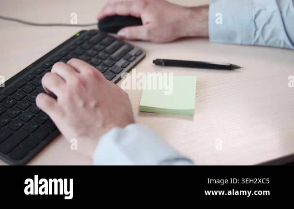 Desk Closeup Hand Smoothing Sticky Note With Amount, Keyboard And Mouse ...