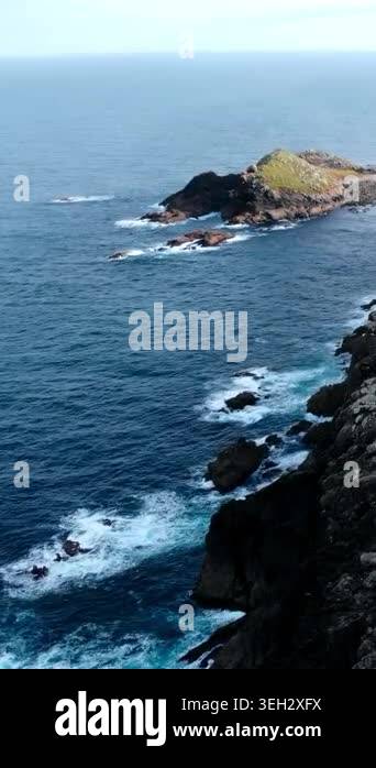 Aerial Lighthouse Atop Rocky Promontory, Keeper Cottage Visible ...