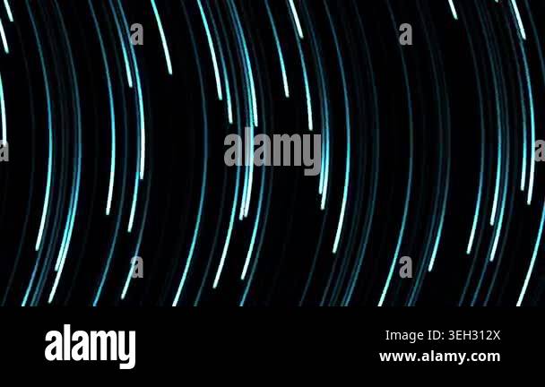 Soft blue and white light streaks flow dynamically downwards against a ...