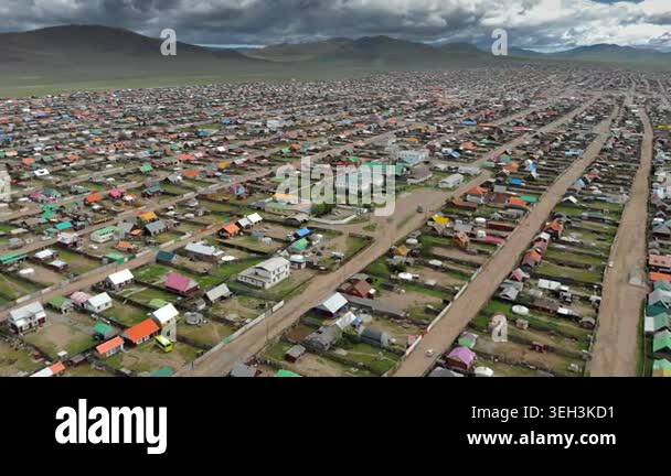Urban housing districts in Mongolia form a colorful city grid of roofs ...