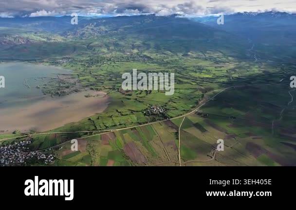 Aerial Nakai Nam Theun Park Laos lake patchwork farmland roads misty ...