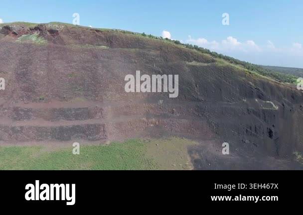 Aerial volcanic tuff cone layers reveal exposed mineral bands and ...