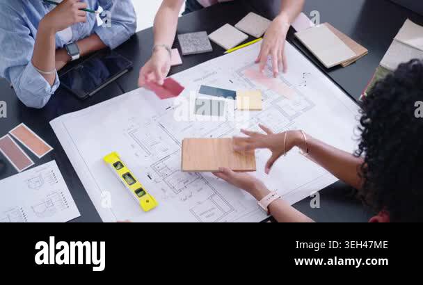 Diverse female designers placing wood sample, arranging swatches on ...