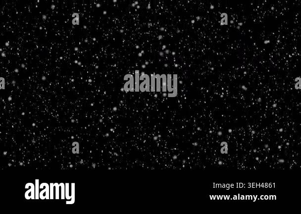 Magical white snow falling through a pitch black void with dreamy ...