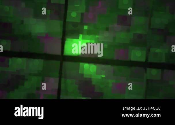 Glowing green light on a dark grid background Stock Video Footage - Alamy