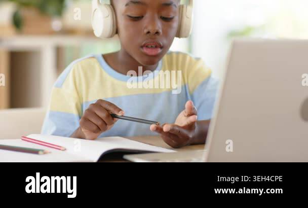Counting fingertips, African American boy writing homework in notebook ...