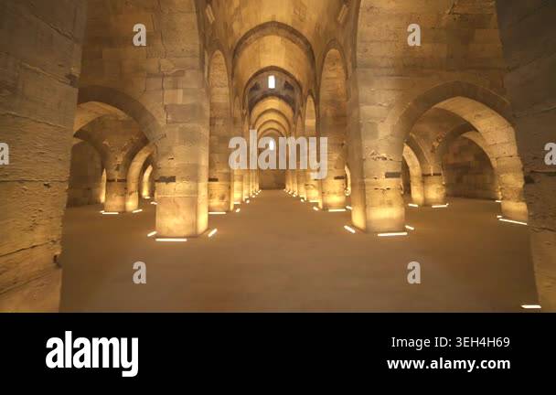 Stone arches and columns line Sultanhani Caravanserai interior in ...