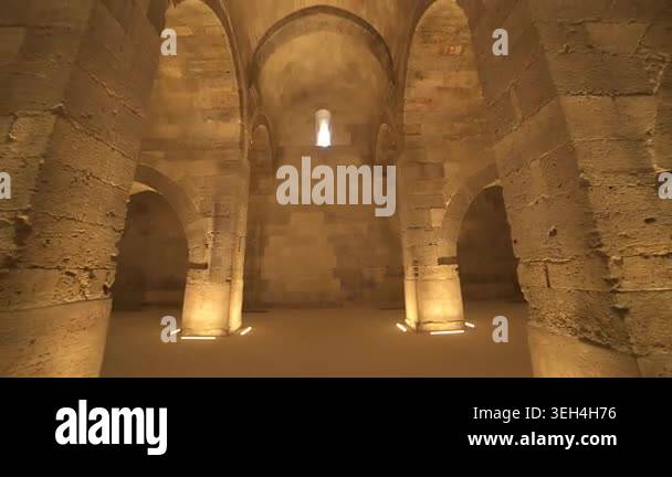 Stone arches and columns line Sultanhani Caravanserai interior in ...