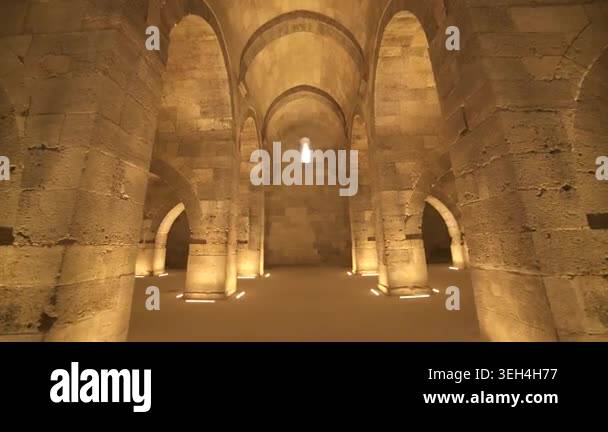 Stone arches and columns line Sultanhani Caravanserai interior in ...