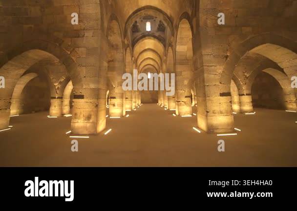 Stone arches and columns line Sultanhani Caravanserai interior in ...