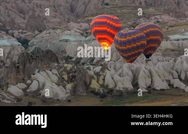 Hot air balloons fill Cappadocia skies above fairy chimneys during a ...