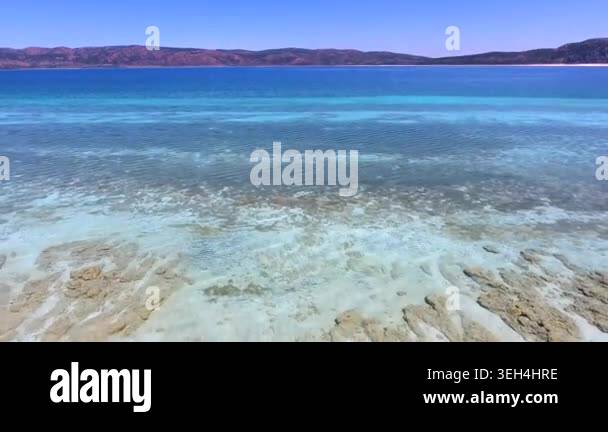 Aerial tropical shallows reveal reef rocks, white sand, algae, and ...