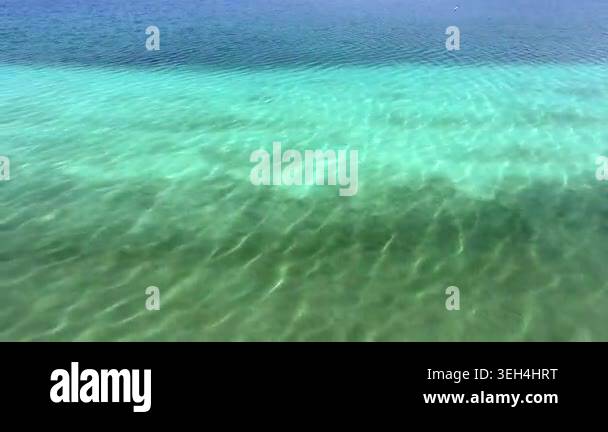 Aerial tropical shallows reveal reef rocks, white sand, algae, and ...
