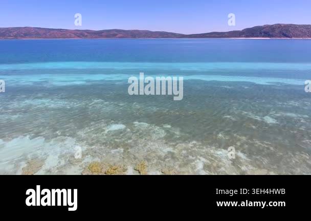 Aerial tropical shallows reveal reef rocks, white sand, algae, and ...