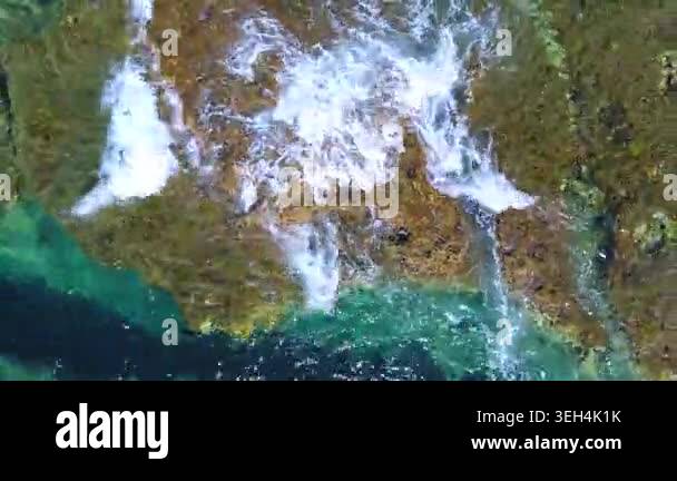 Aerial drone overhead of submerged rock and seamount in Chile with ...