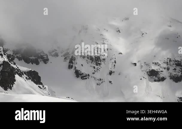 Snow covered mountains Andes above alpine valleys icy ridges winter ...