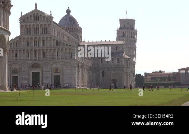 Pisa Cathedral and Leaning Tower stand in Italy, celebrated marble ...