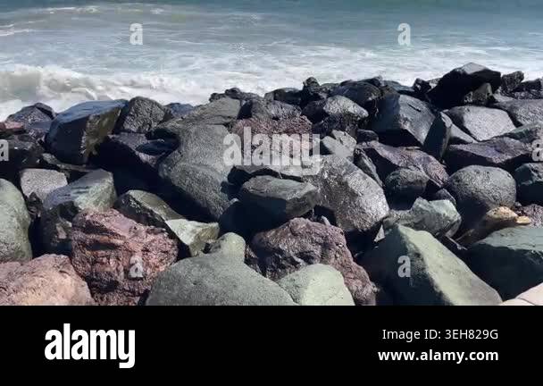 Sea Waves Crashing Against Rocks, Coastal Splash, 4K Wide Shot Stock ...