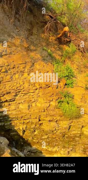 Vertical Pan Left of Sunlit Rock Formation, Rough Stone Texture, 4K ...