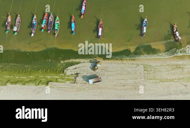 Top view of algae forming along the sandy coast of Patong Beach with ...
