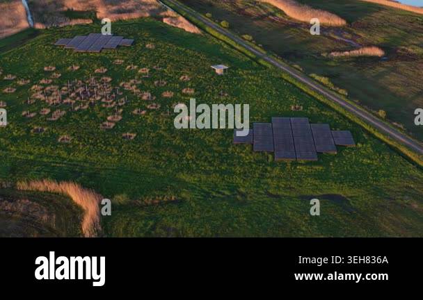 Aerial perspective of small solar panel farms generating clean energy ...
