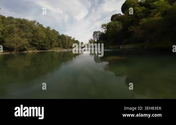 Exhilarating first person view of a drone flying at high speed over a ...