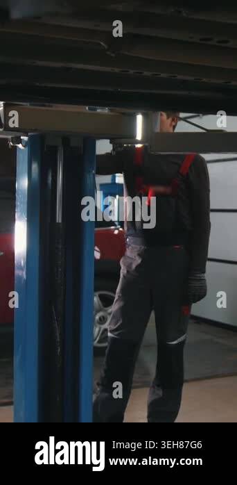 Car in auto service moves down for repairing,close up Stock Video ...