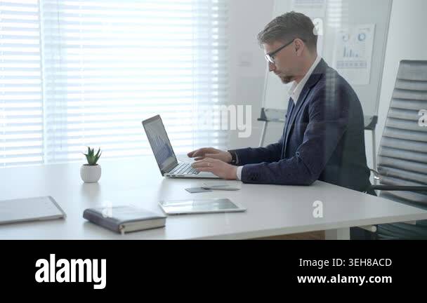 Professional businessman working on a laptop computer. Concentrating on ...