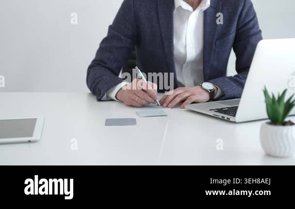 Professional businessman working on a laptop computer. Concentrating on ...