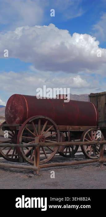 Vertical Screen: Antique rusty red metal water tank mounted on old ...