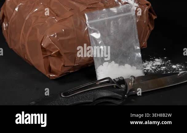Concept of brown packages filled with drugs and wrapped in duct tape to ...
