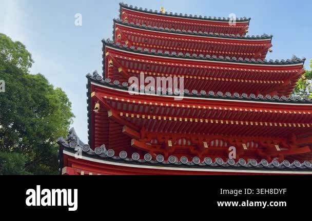 Red pagoda of Tochoji Shingo Buddhist Temple rises against the blue sky ...