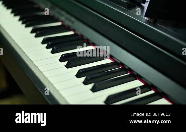 Mechanical metronome on piano, pendulum swinging to keep tempo. Closeup ...