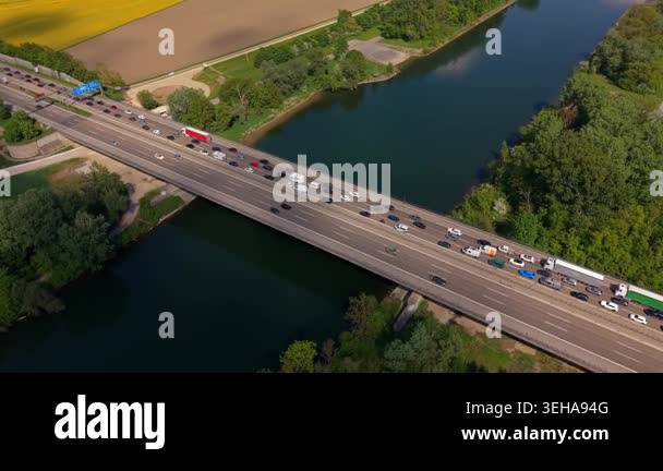 Aerial panorama of A9 highway bridge over Danube reveals long queues of ...