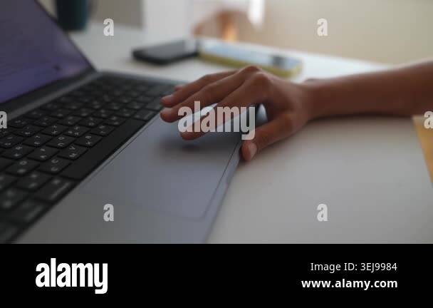 Closeup of hands editing document on laptop, soft daylight through ...