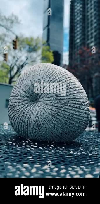 Textured Spherical Sculpture on Outdoor Metal Table. Close-up of ribbed ...